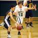 Eastern Washtenaw Multicultural senior Sami Farha moves the ball around Greenhills junior Andrew Khouri Abe during the first half at Greenhills on Thursday. Melanie Maxwell I AnnArbor.com